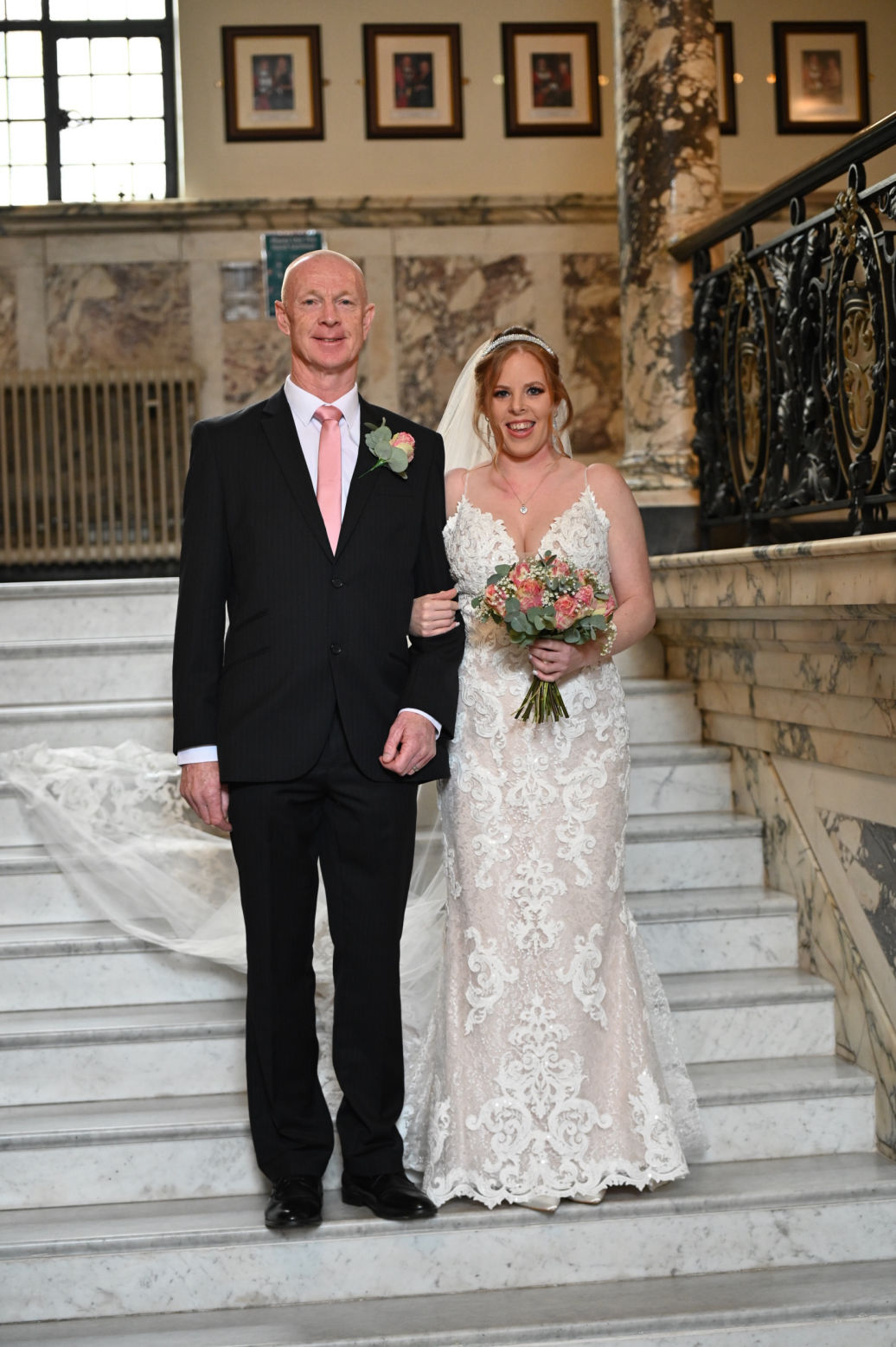 Relaxed wedding portrait on Stockport Town Hall staircase