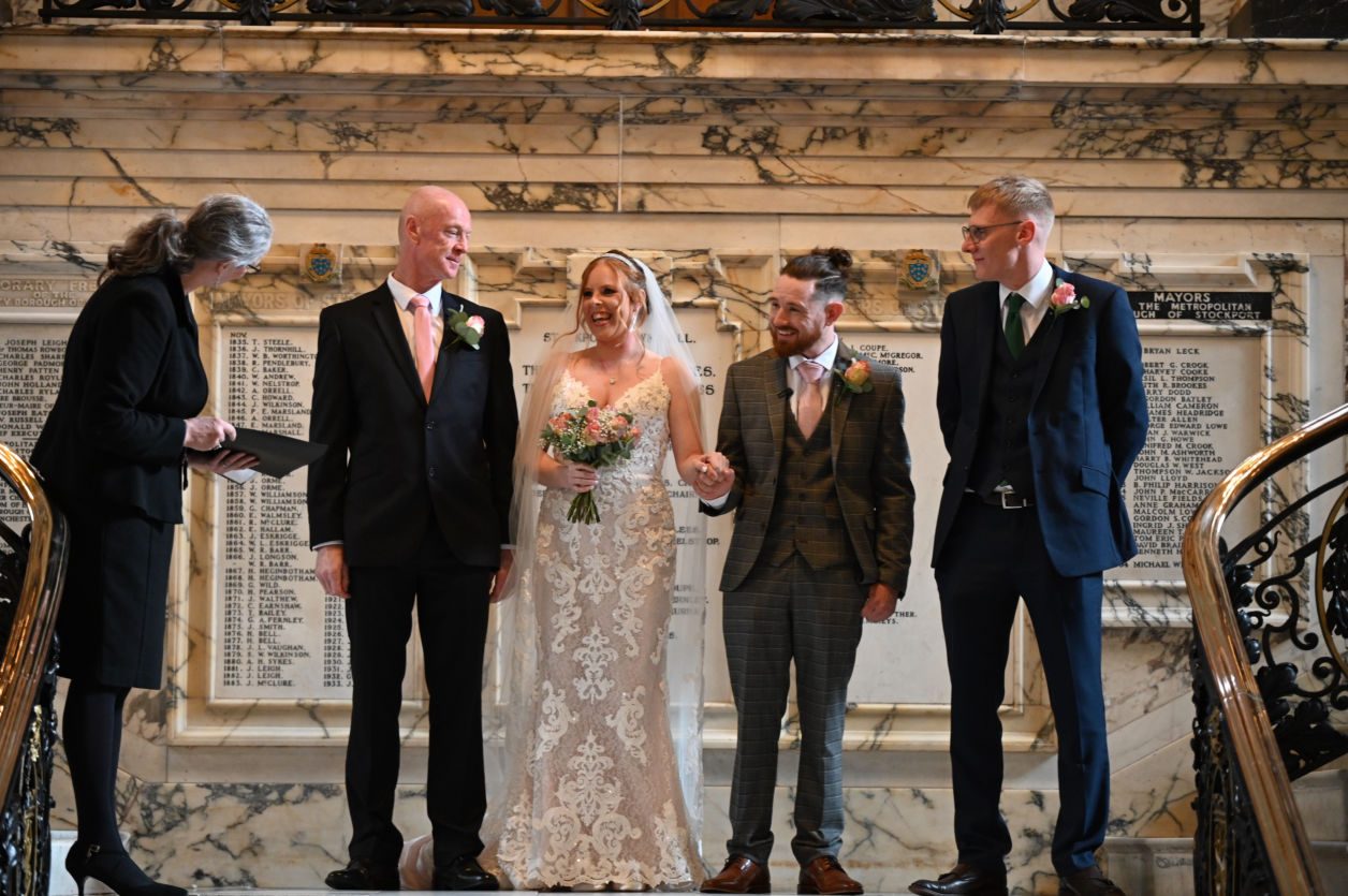 The father of the bride giving his daughter to the groom at stockport town hall